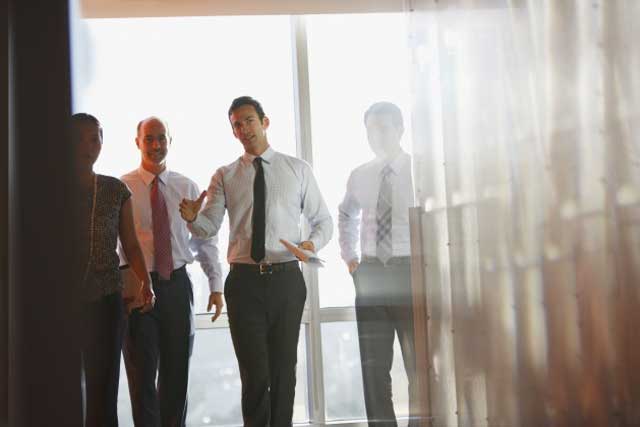 Men walking through hallway