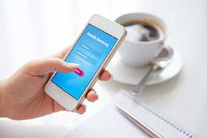 Woman checking her CD account through a mobile banking app