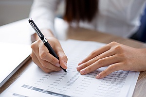 a business owner reviewing her transactions from online banking