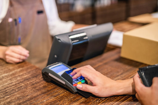 Business using a merchant services program