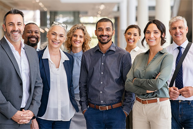 group of professional men and women standing