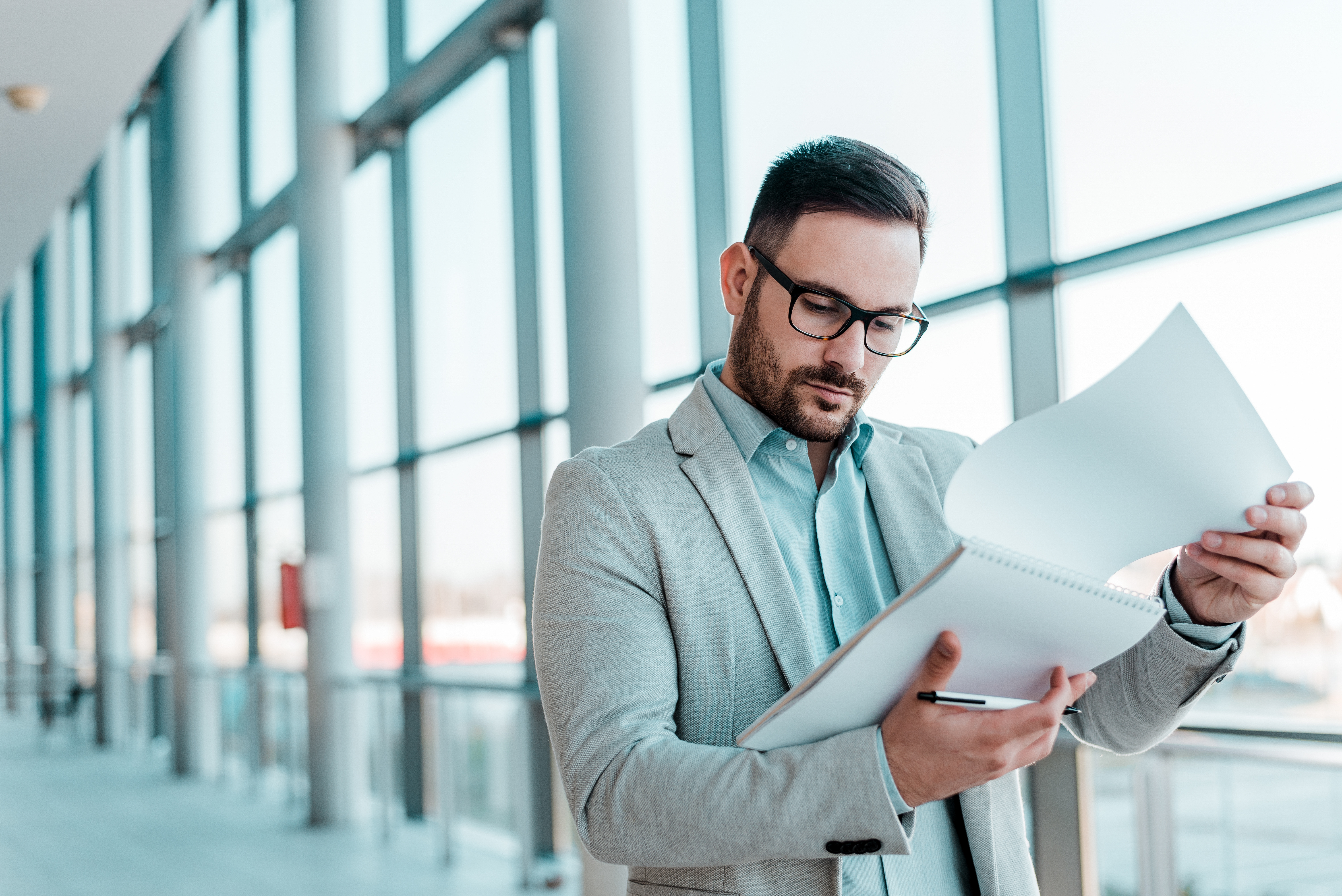 business man reviewing documents in corporate office