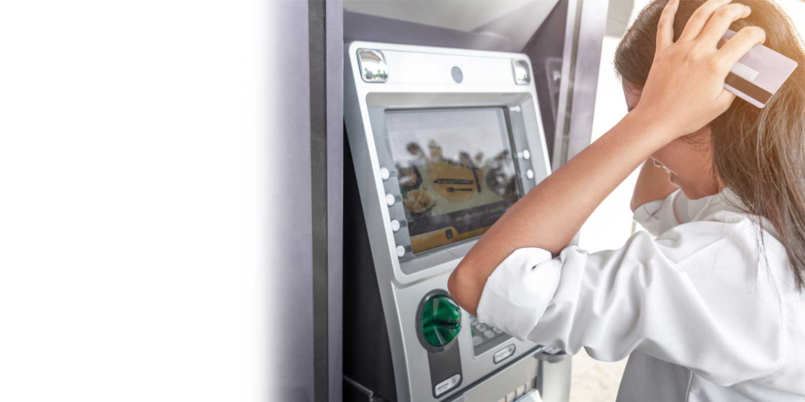 Woman using ATM