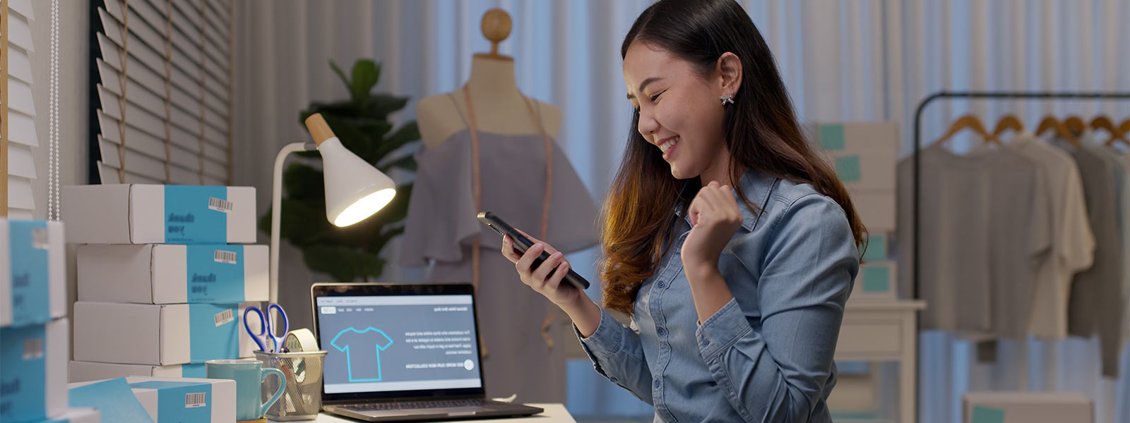 small business owner smiling at her phone