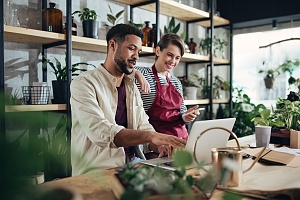 small business owners using computer to apply for loan