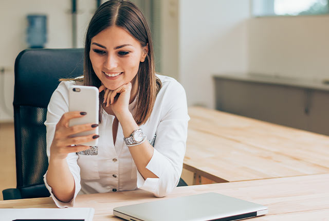 women using her phone for online banking